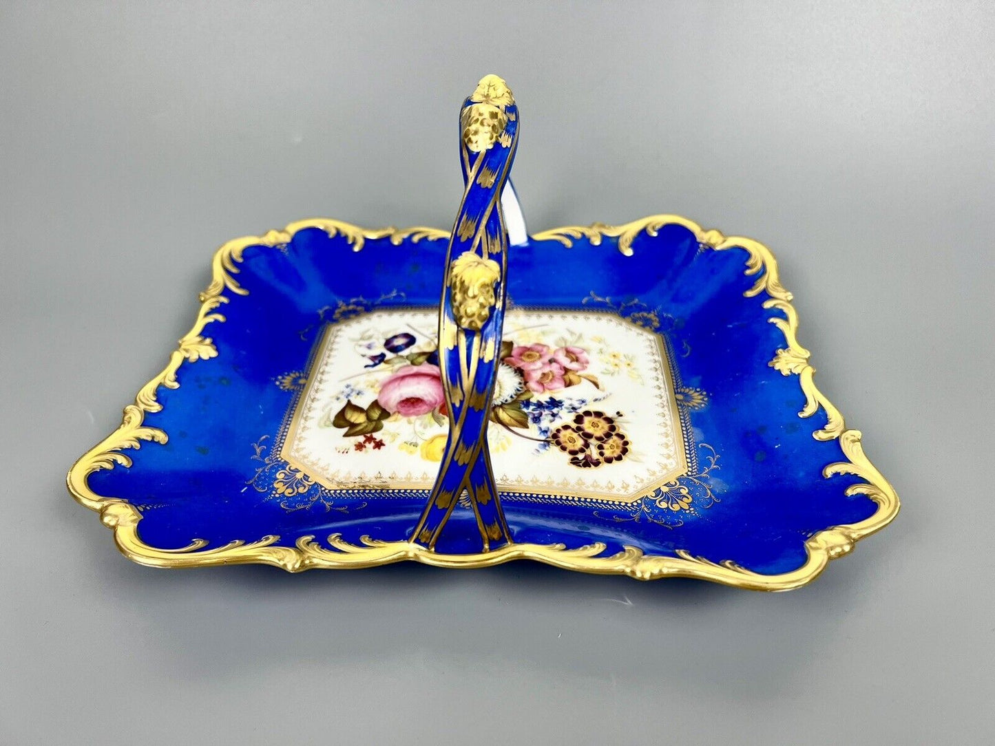A lovely Samuel Alcock fruit basket finely painted with garden flowers. c.1830