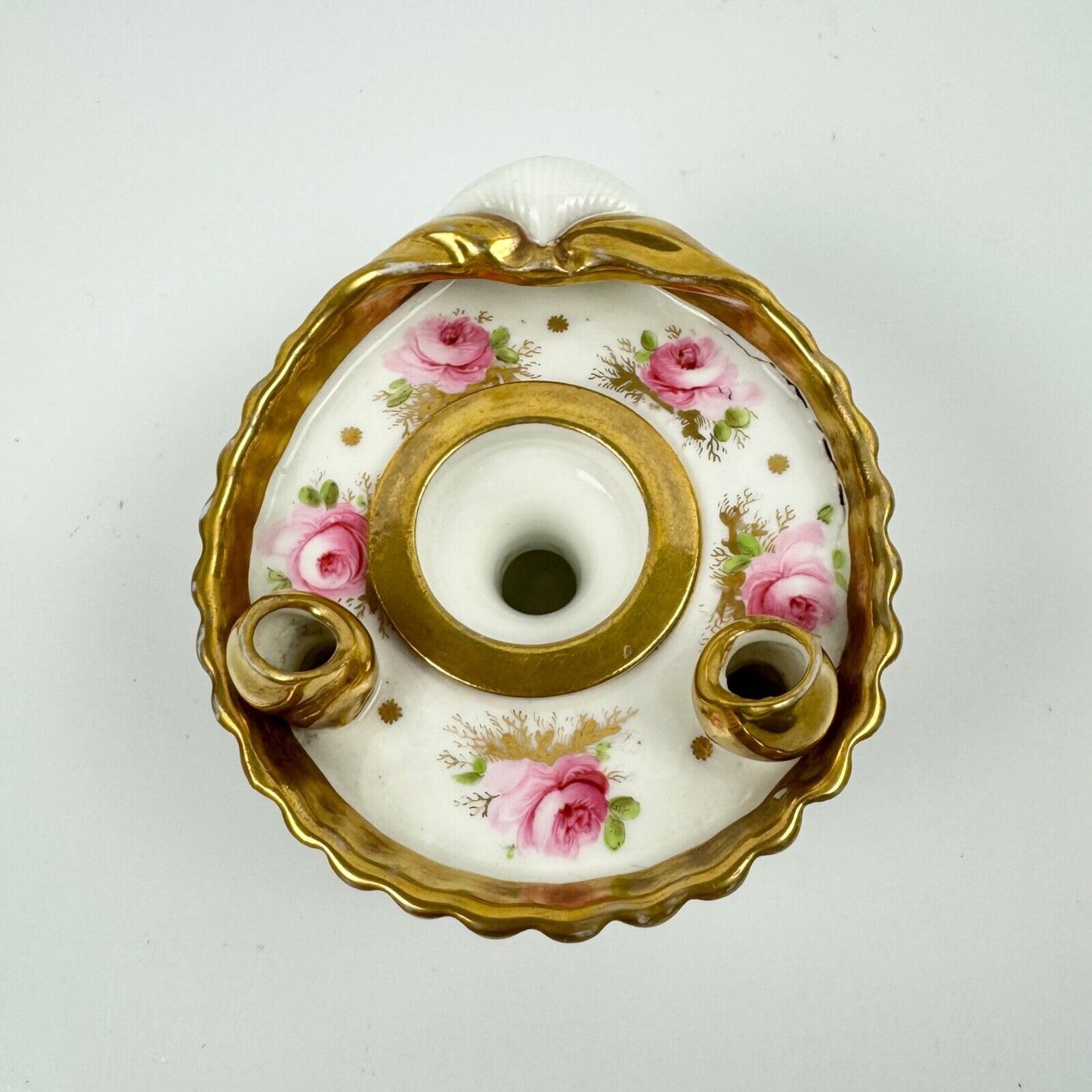 A fine shell-shaped Swansea inkwell and liner painted with roses c1814-26