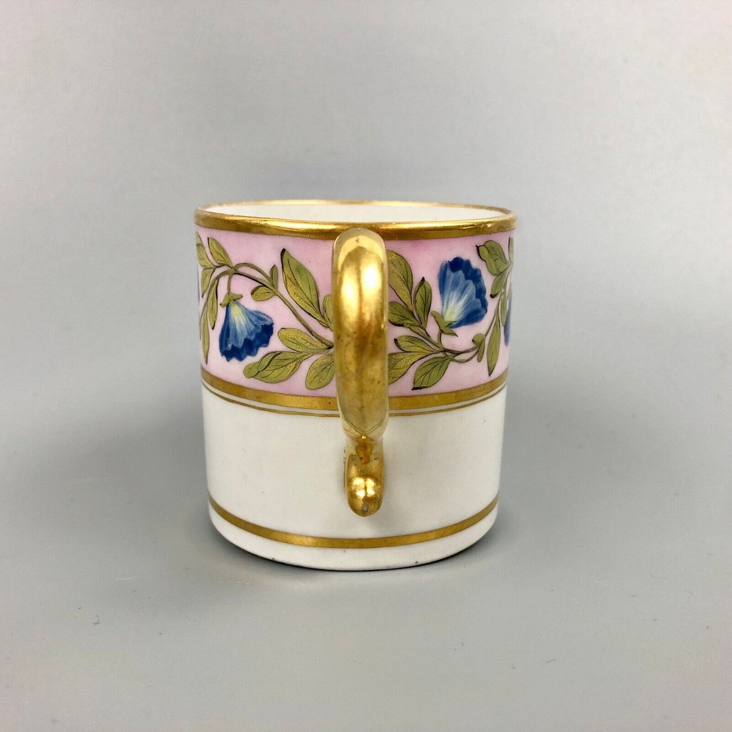 A Barr Worcester coffee can with a floral band on salmon ground c.1795-1805