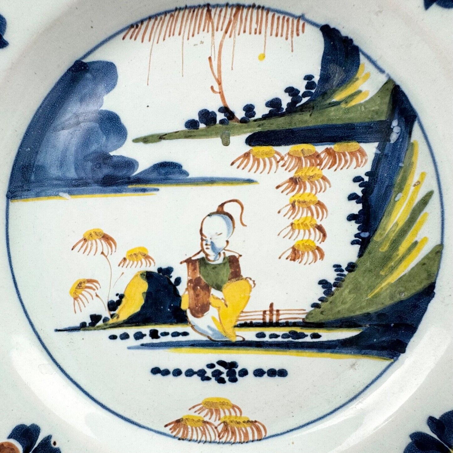 A Lambeth (Abigail Griffiths) delft plate, c.1760, painted in polychrome enamels