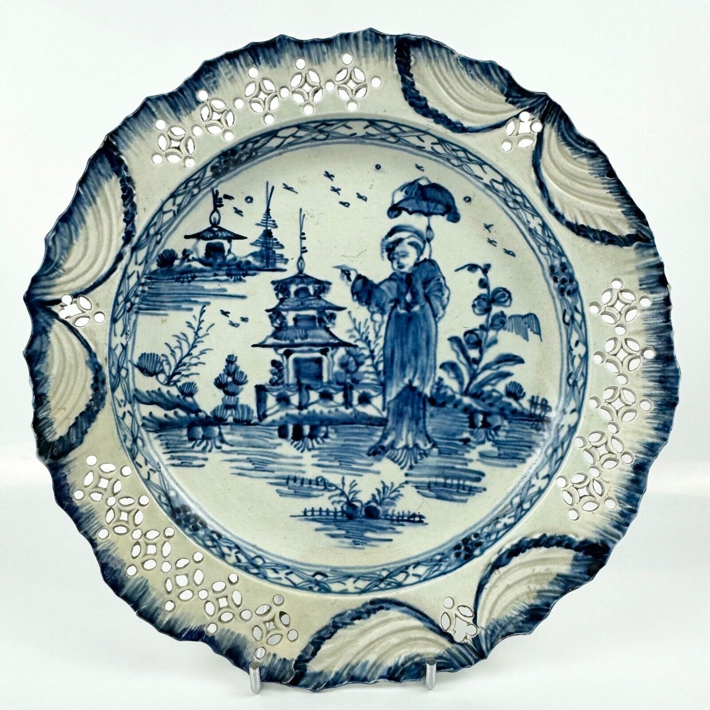 A fine pearlware reticulated plate painted with a 'Long Eliza' figure. c.1790