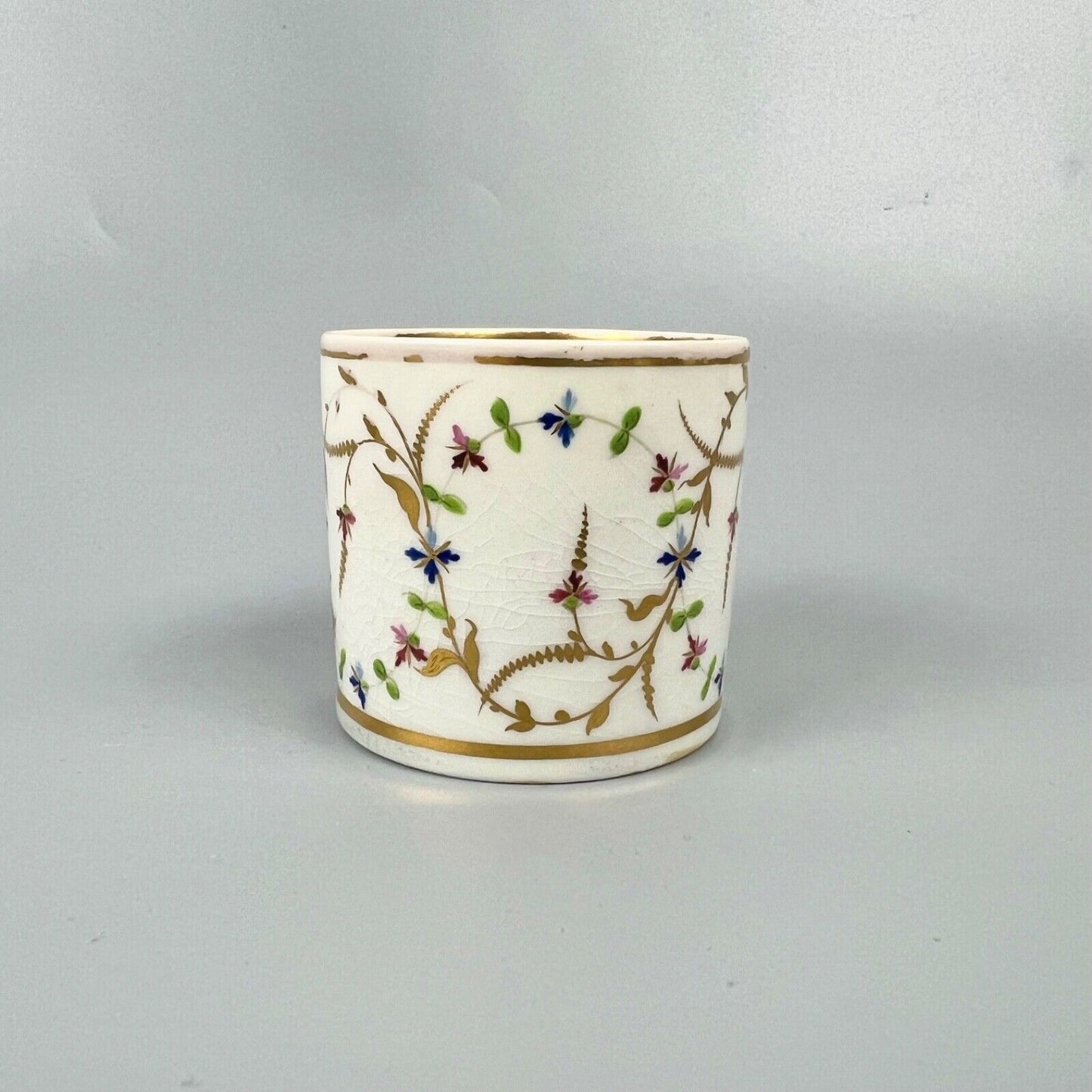 A late 18thc Derby Porcelain cup in pattern number 552. Puce mark. c1795