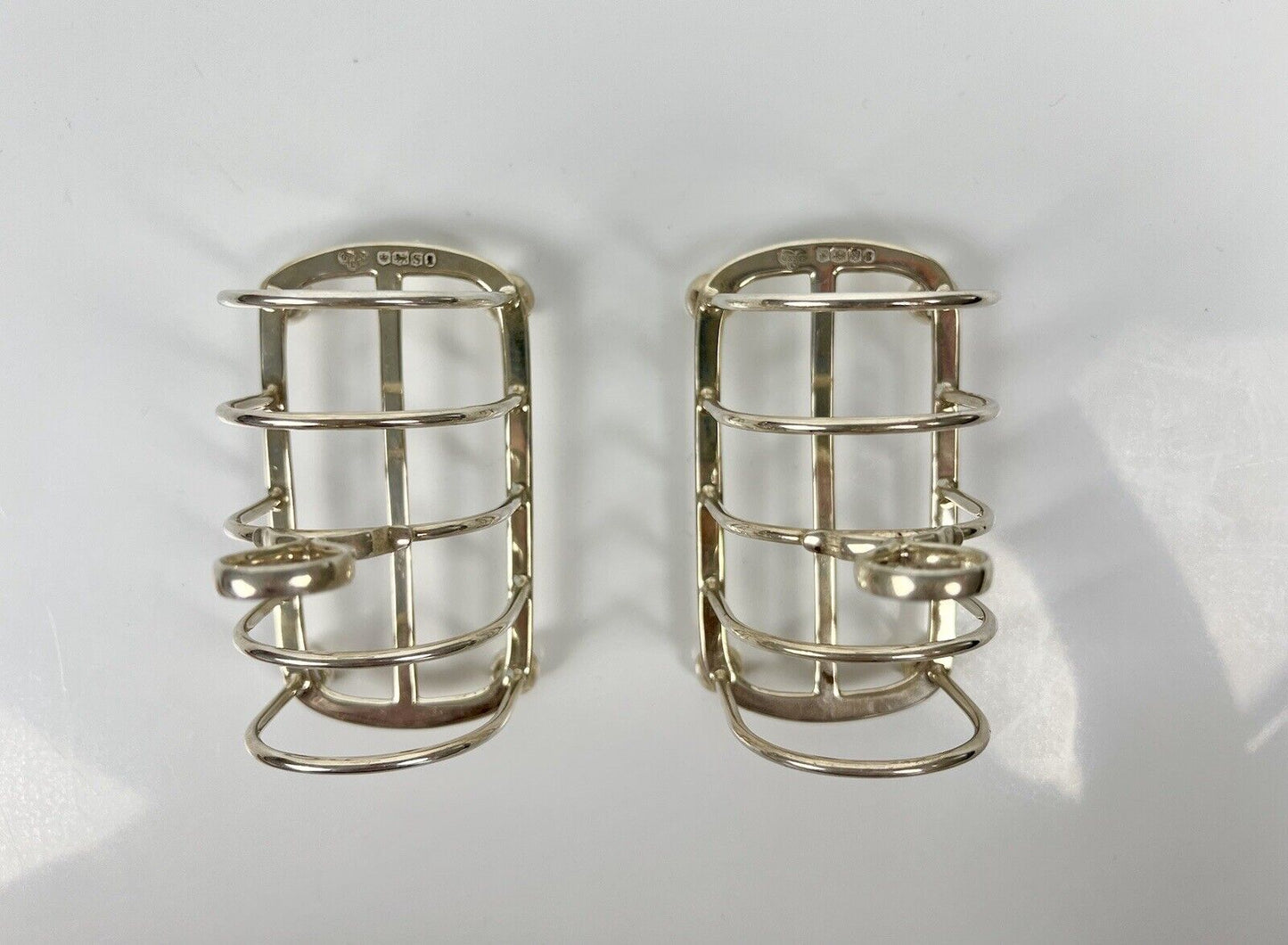 A Pair Of Goldsmith And Silversmith's Company Toastracks. Sheffield 1935.