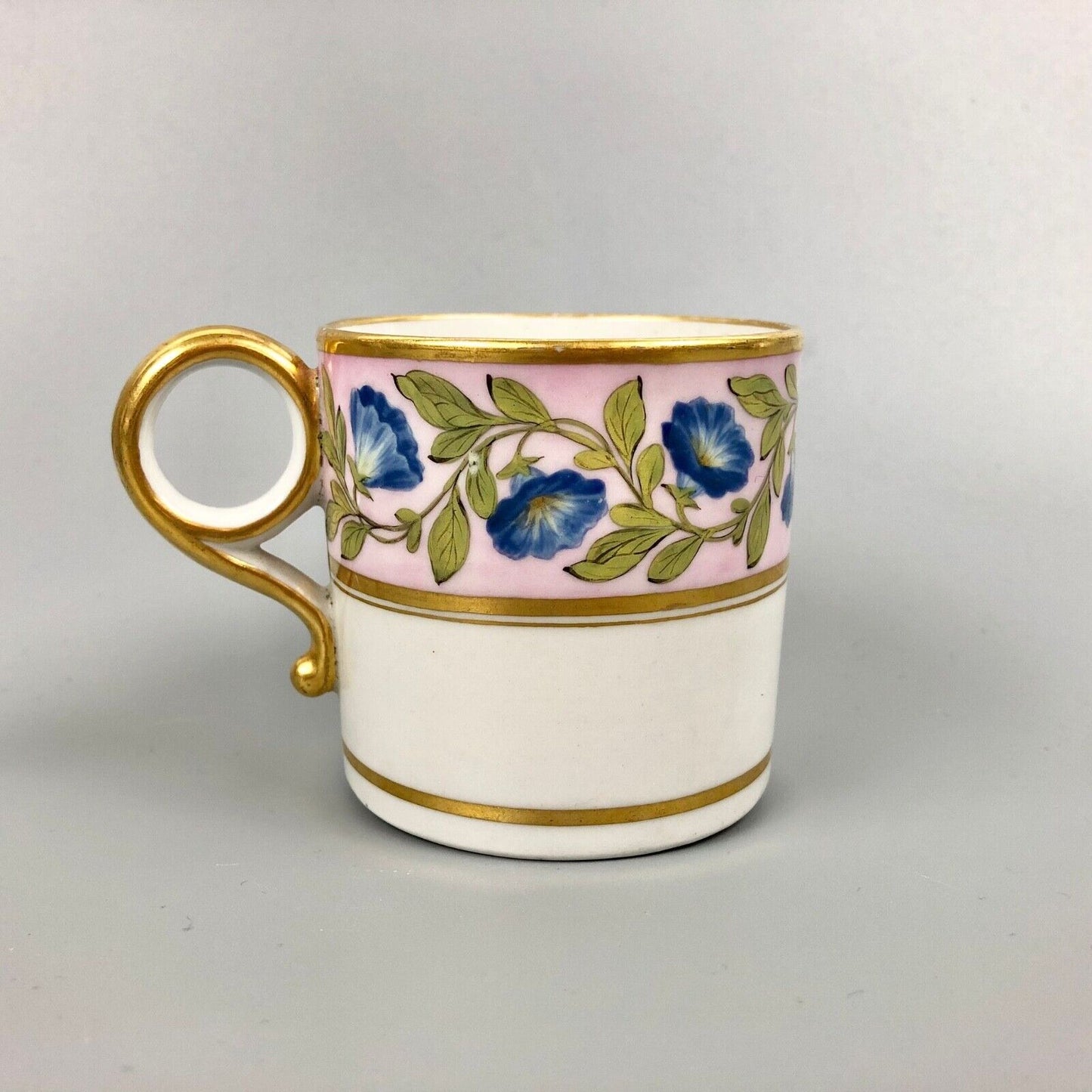 A Barr Worcester coffee can with a floral band on salmon ground c.1795-1805