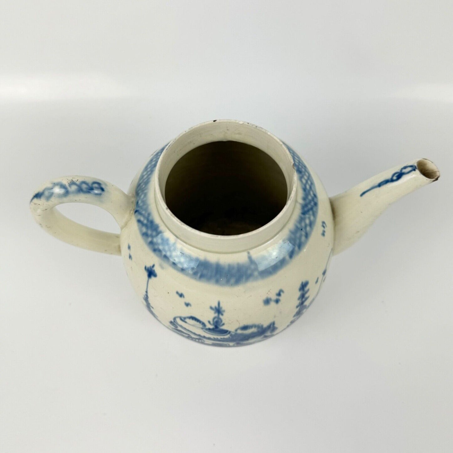 A Staffordshire c1790 hand-painted with a chinoiserie scene pearlware teapot.