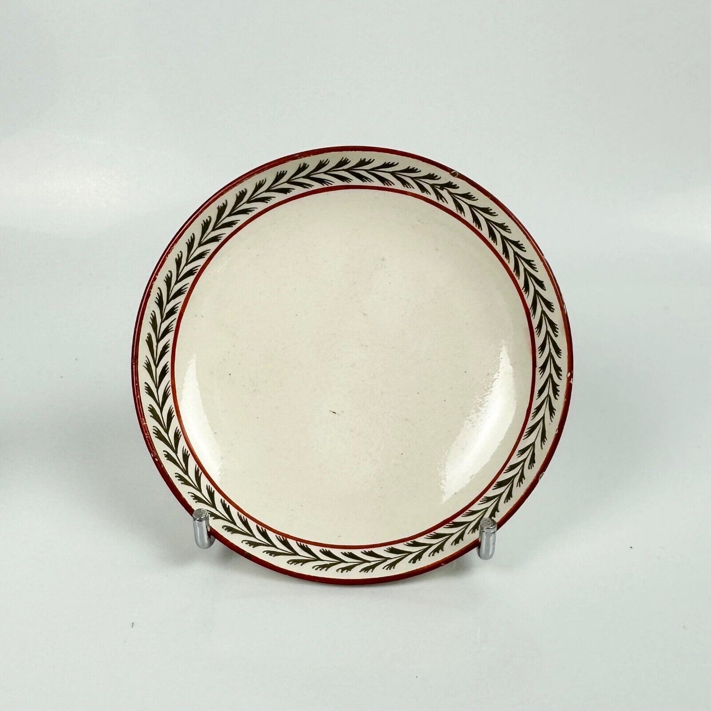 A fine creamware teabowl and saucer with painted foliate decoration. c.1790