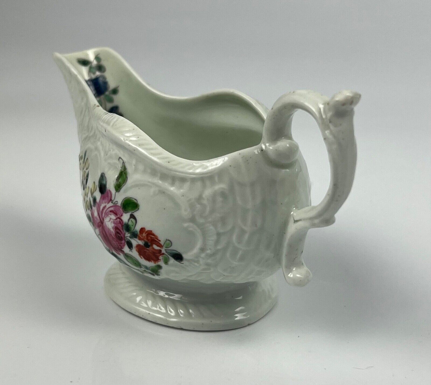A Philip Christian Liverpool moulded polychrome porcelain sauceboat c.1770