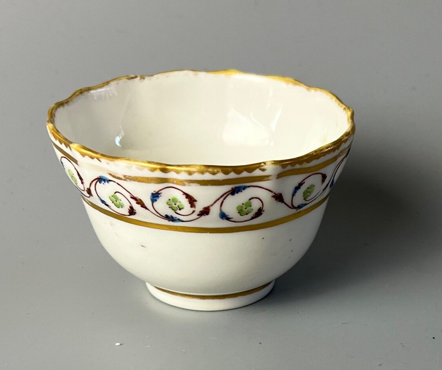 An uncommon Derby scalloped tea bowl and saucer in pattern number 115 c.1784-90