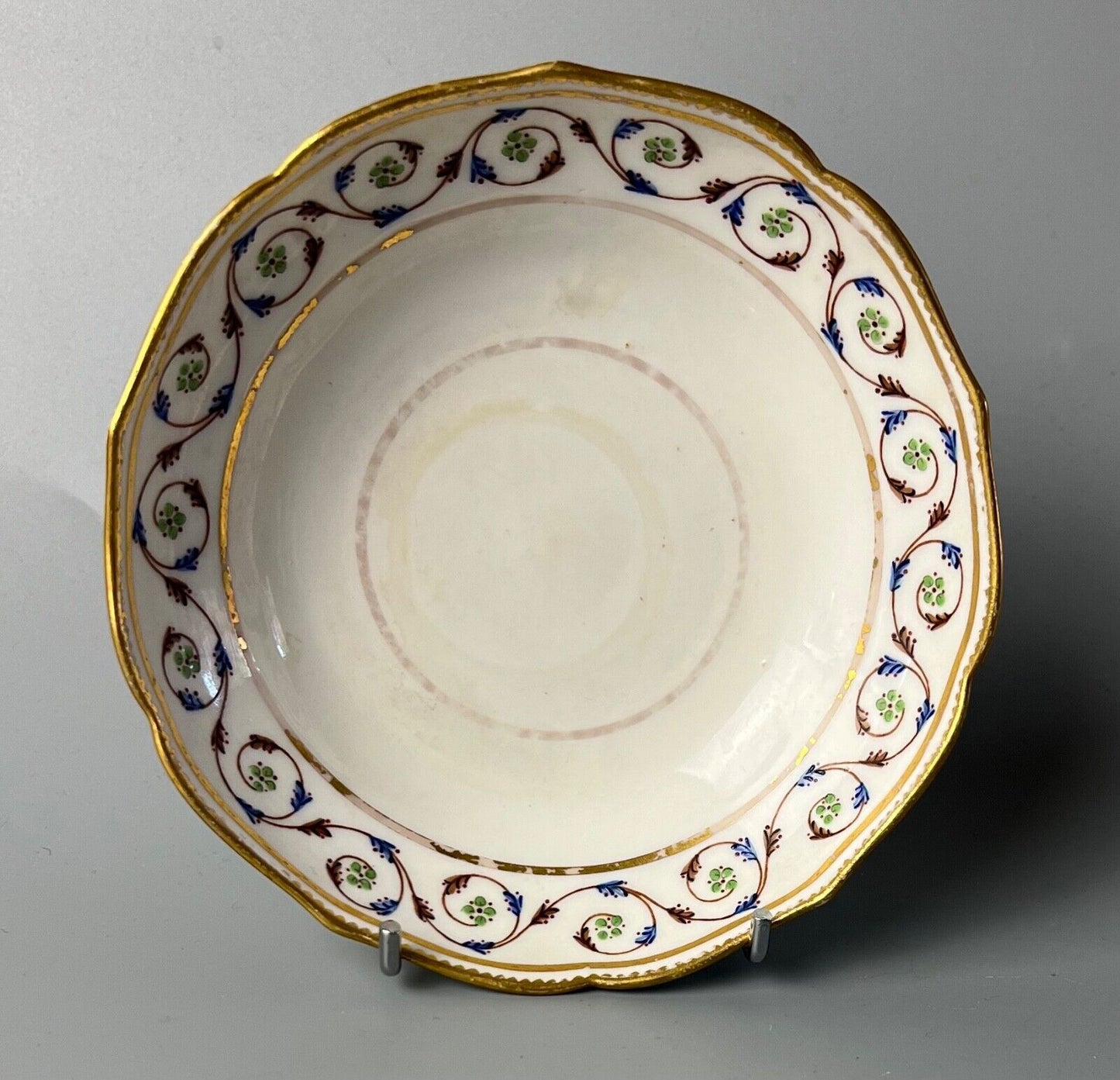 An uncommon Derby scalloped tea bowl and saucer in pattern number 115 c.1784-90