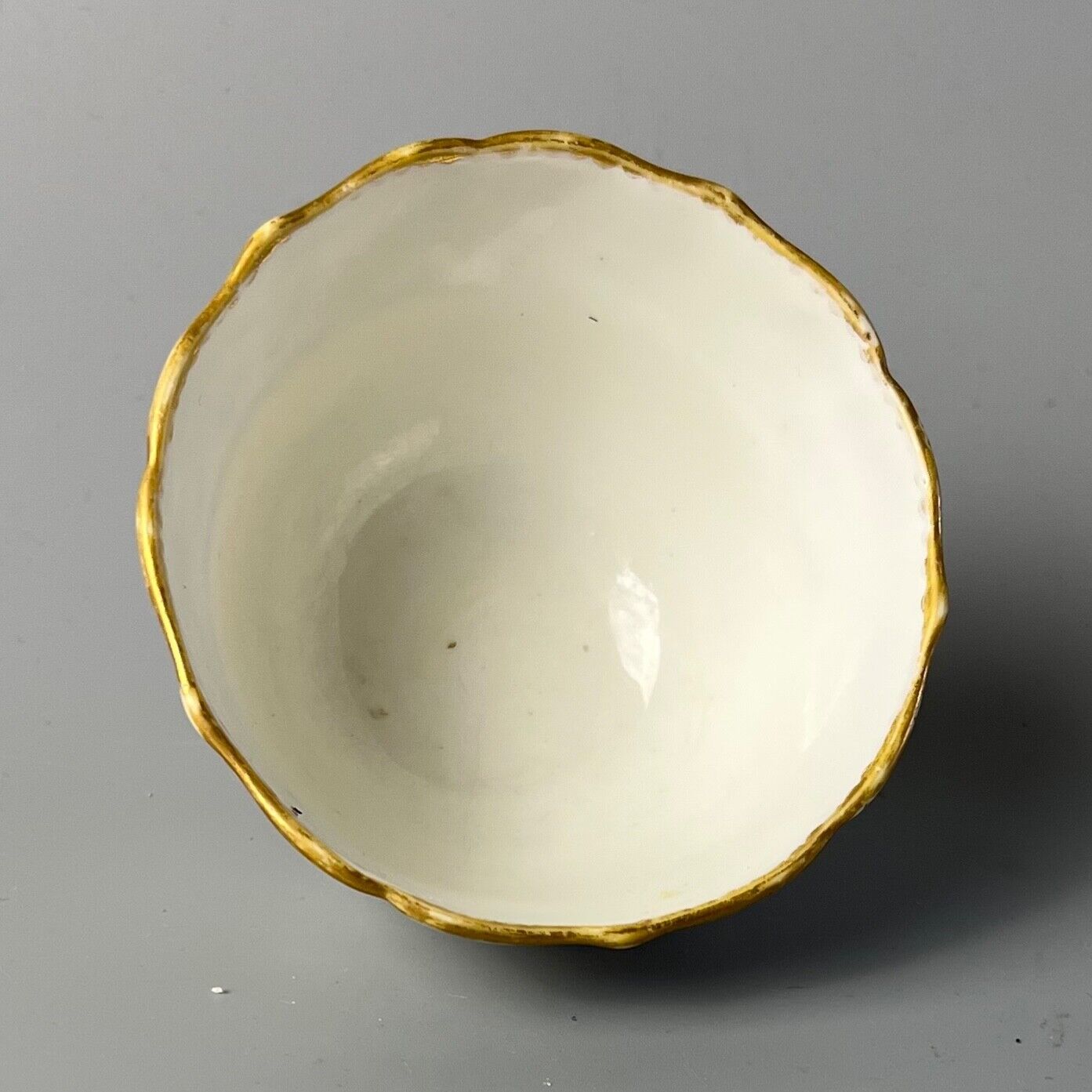 An uncommon Derby scalloped tea bowl and saucer in pattern number 115 c.1784-90