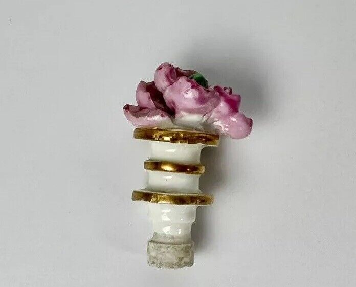 Rockingham porcelain flower encrusted tapered scent bottle. Puce Mark. c.1831-7