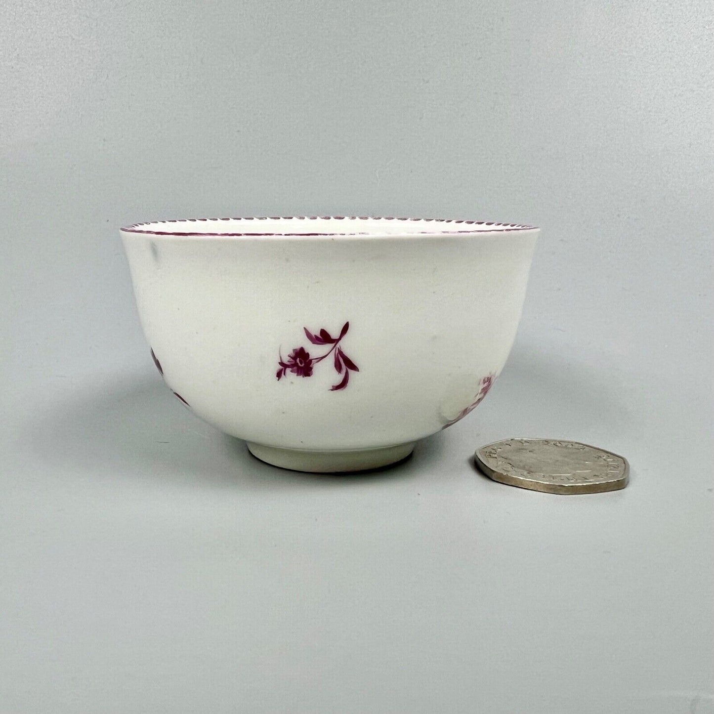 A Vienna porcelain teabowl painted with puce figures c1770-5
