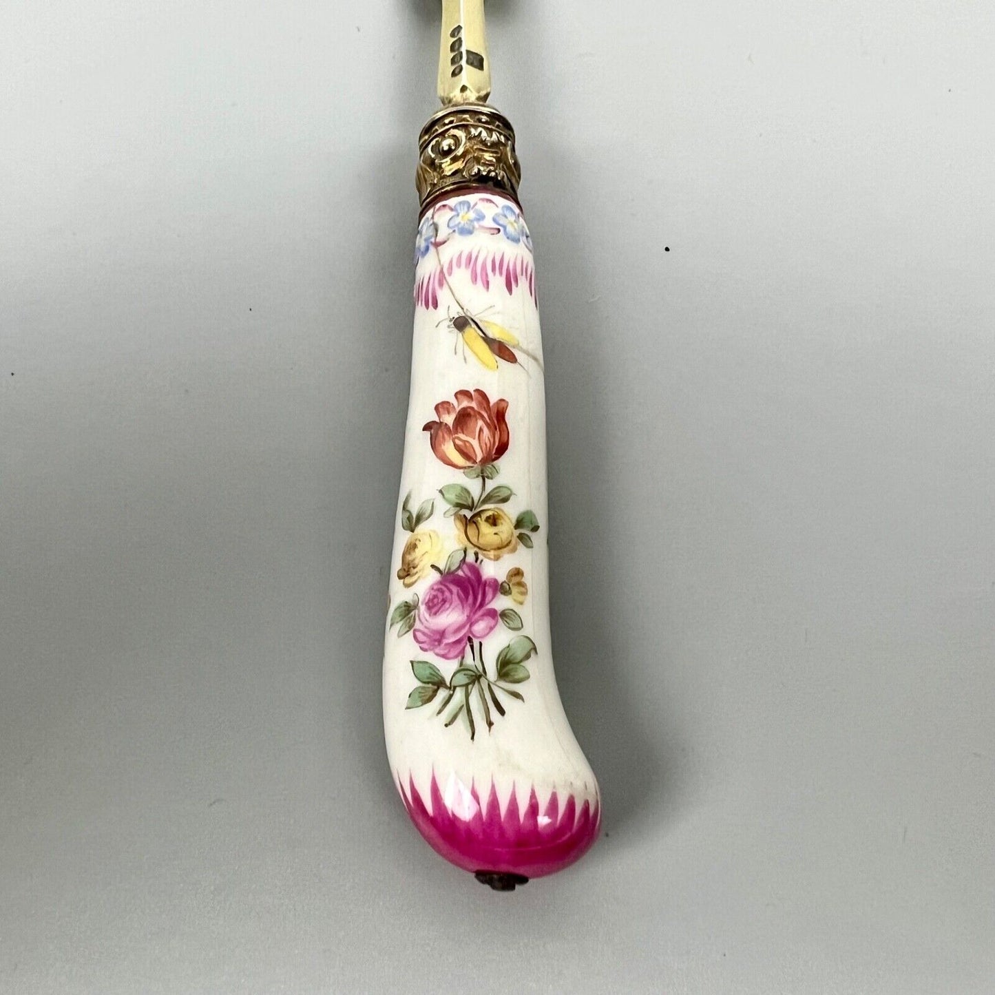A sterling silver-gilt knife & fork set-the silver c.1863, the porcelain c.1760