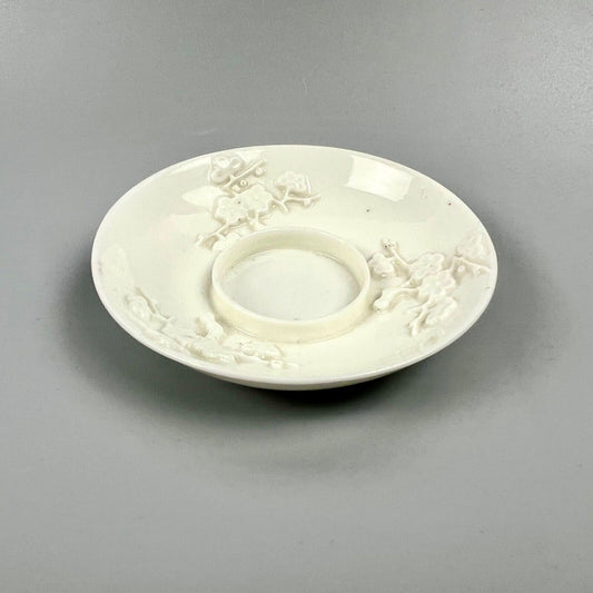 A rare St Cloud trembleuse saucer with prunus relief-moulding c.1735