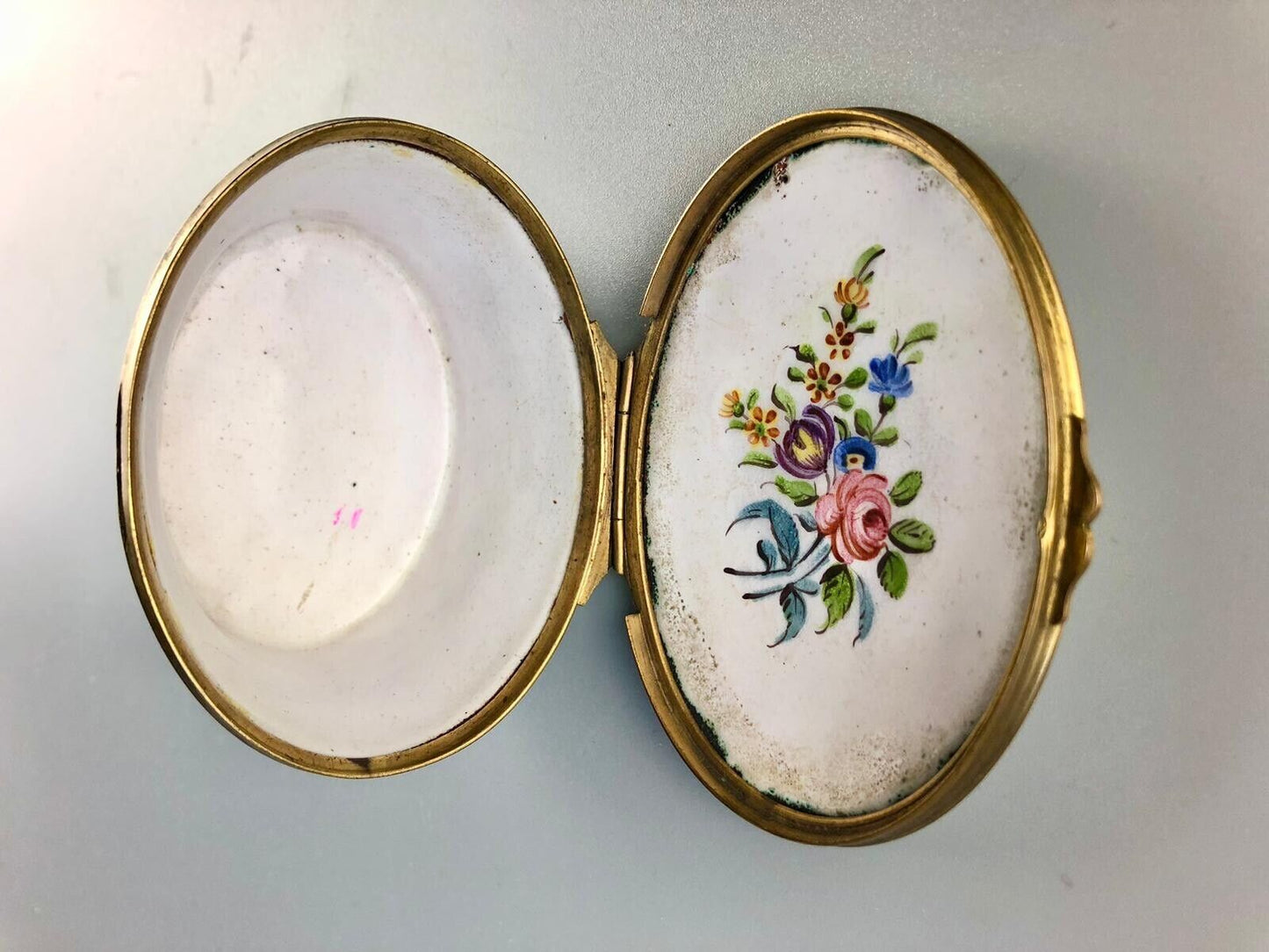 A superb 1775 enamel on copper table snuff box painted with harbour scenes.