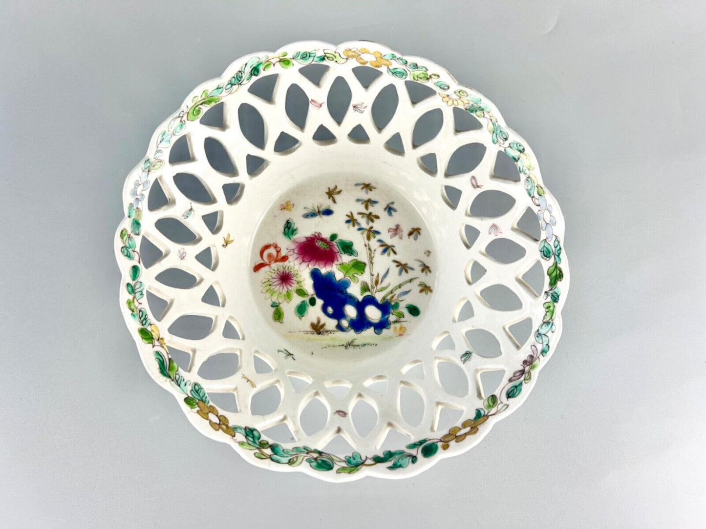 A fine and early Bow porcelain famille rose reticulated basket c.1752