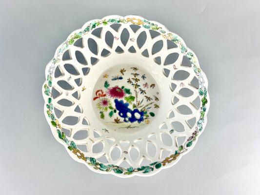 A fine and early Bow porcelain famille rose reticulated basket c.1752