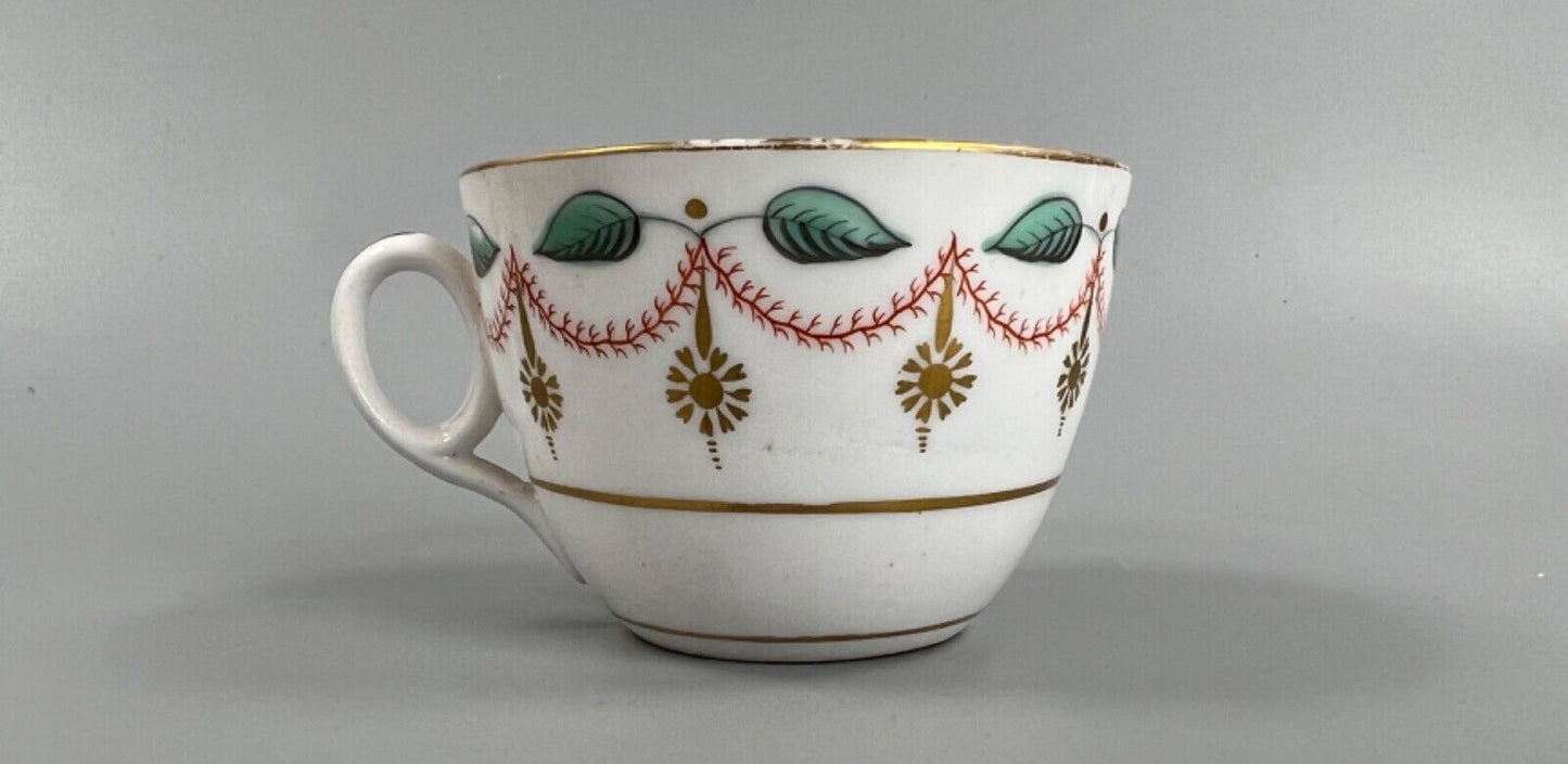 An early 19thc bute shape New Hall cup and saucer in pattern number 1152