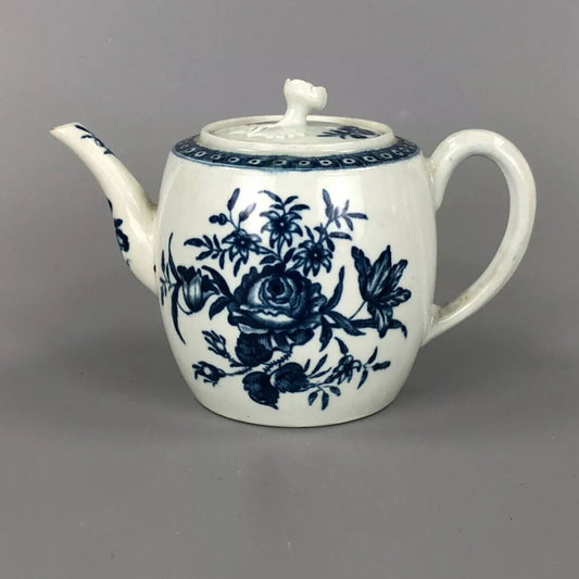 A Worcester barrel teapot, c1770. Printed with the "rose-centred spray" pattern.