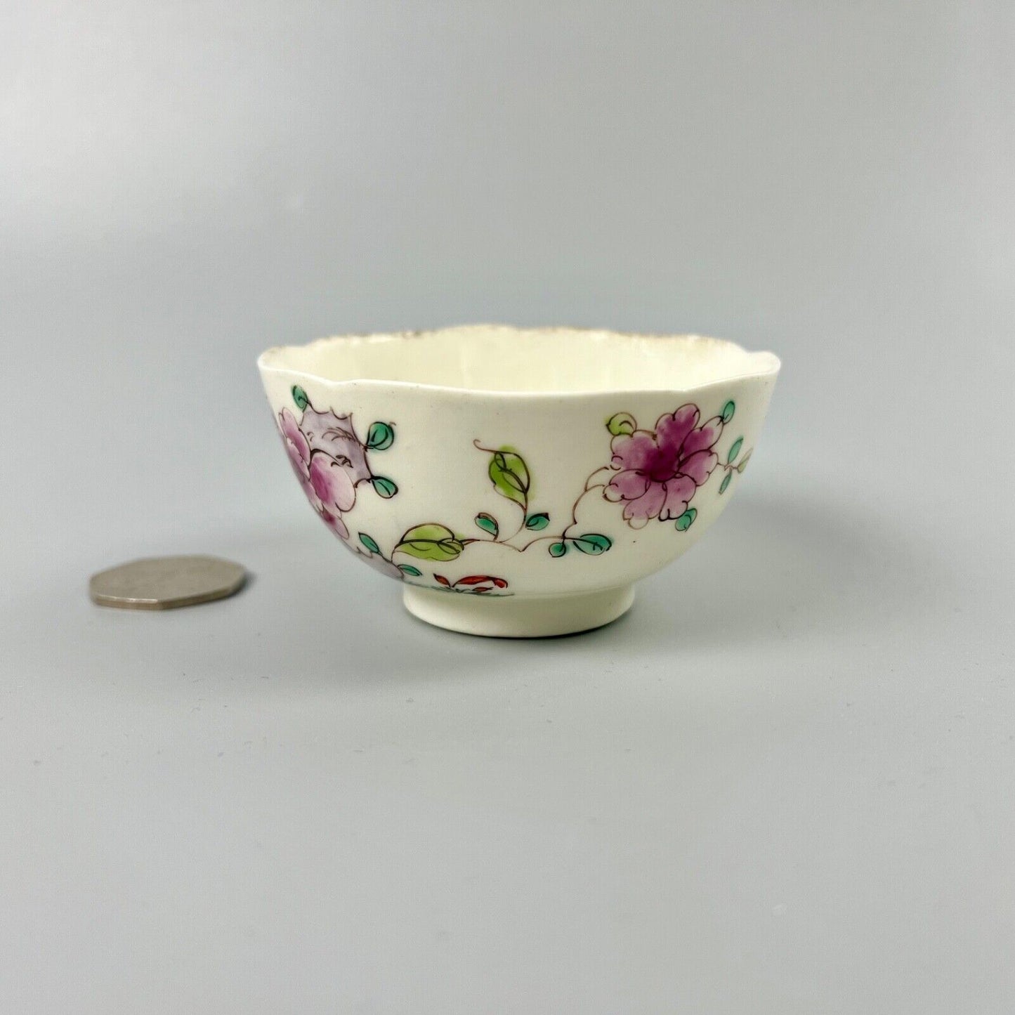 An unusual Bow teabowl painted with famille rose floral sprays c.1750-3