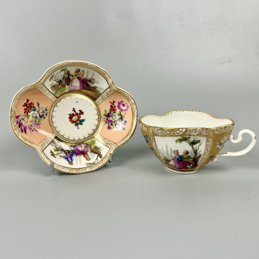 Dresden quatrefoil teacup & saucer painted with romantic scenes. 'AR' mark c1880