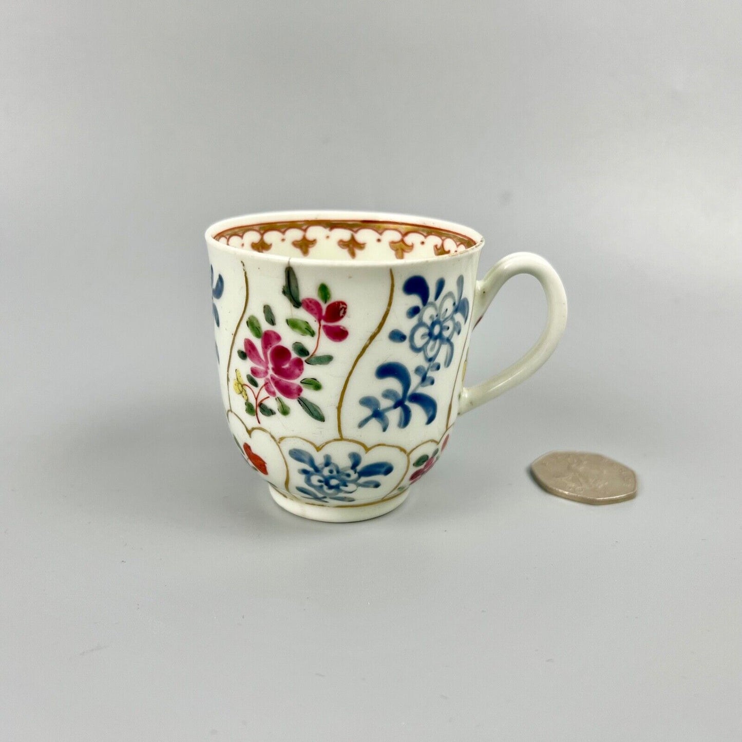 1st Period Worcester outside decorated coffee cup. Gilt trellis inner rim. c1770