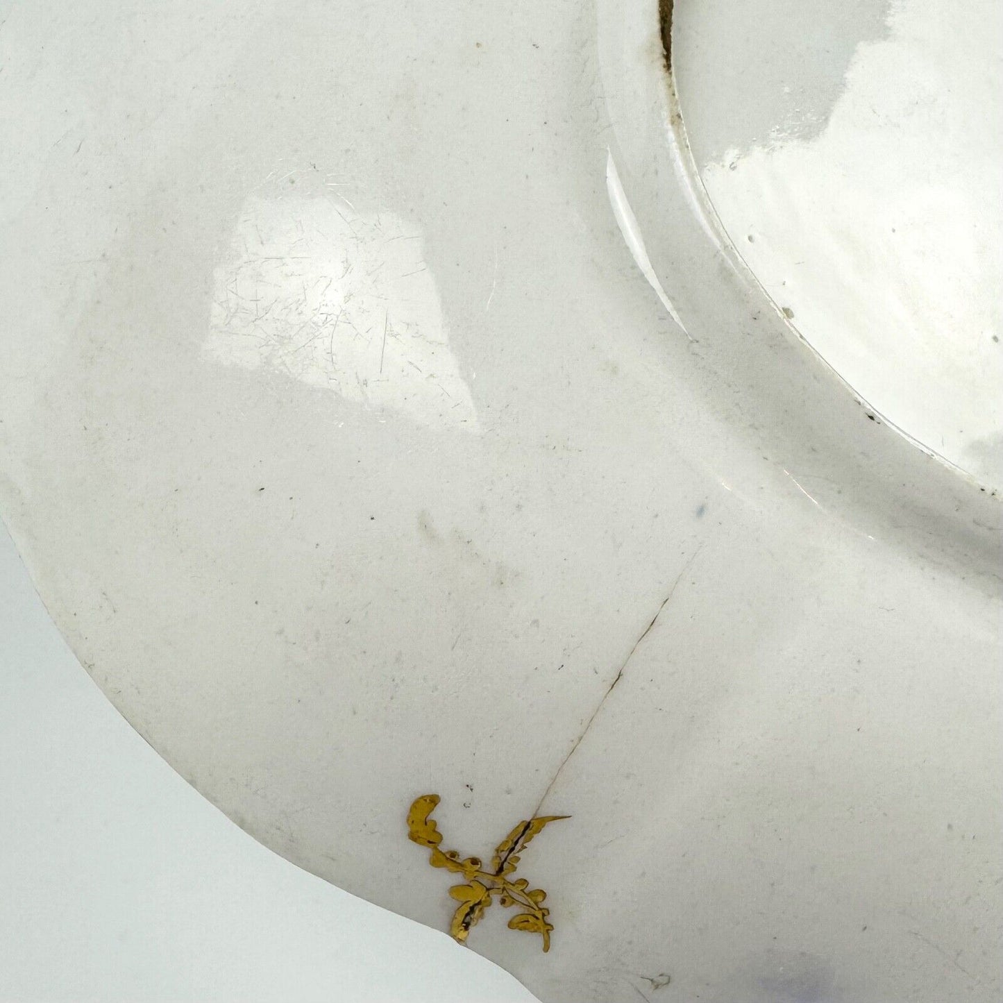 A Chelsea lobed dish painted with an urn and neo classical decoration. c.1760