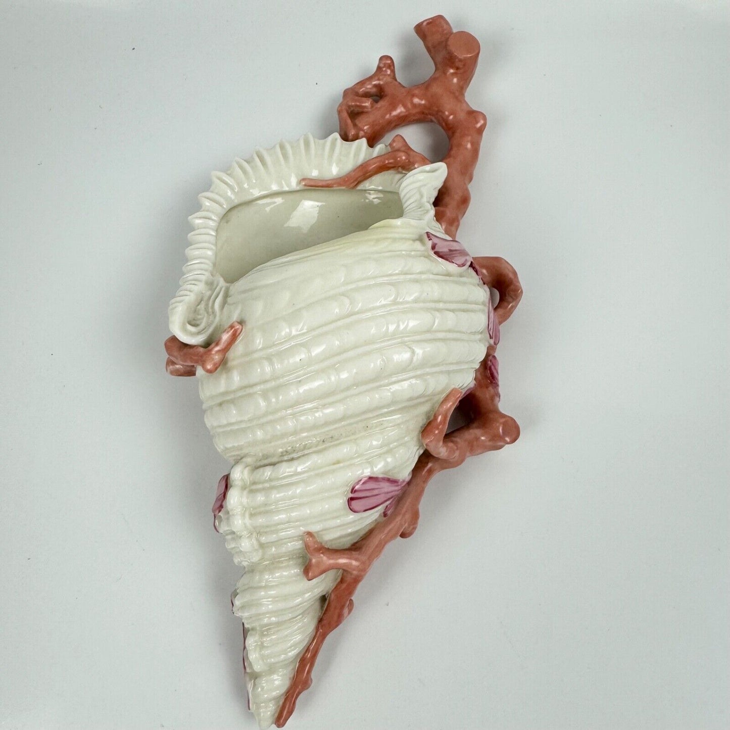 A 19thc Royal Worcester coral and shell wall pocket.