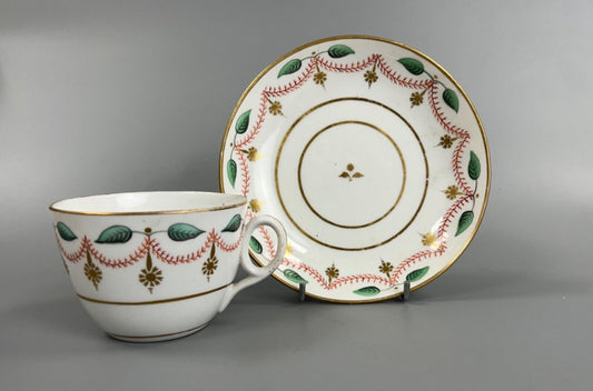 An early 19thc bute shape New Hall cup and saucer in pattern number 1152