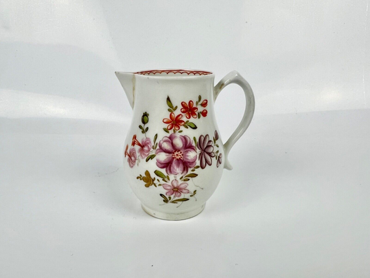 A Lowestoft 'Tulip Painter' creamer painted with floral sprays c.1775