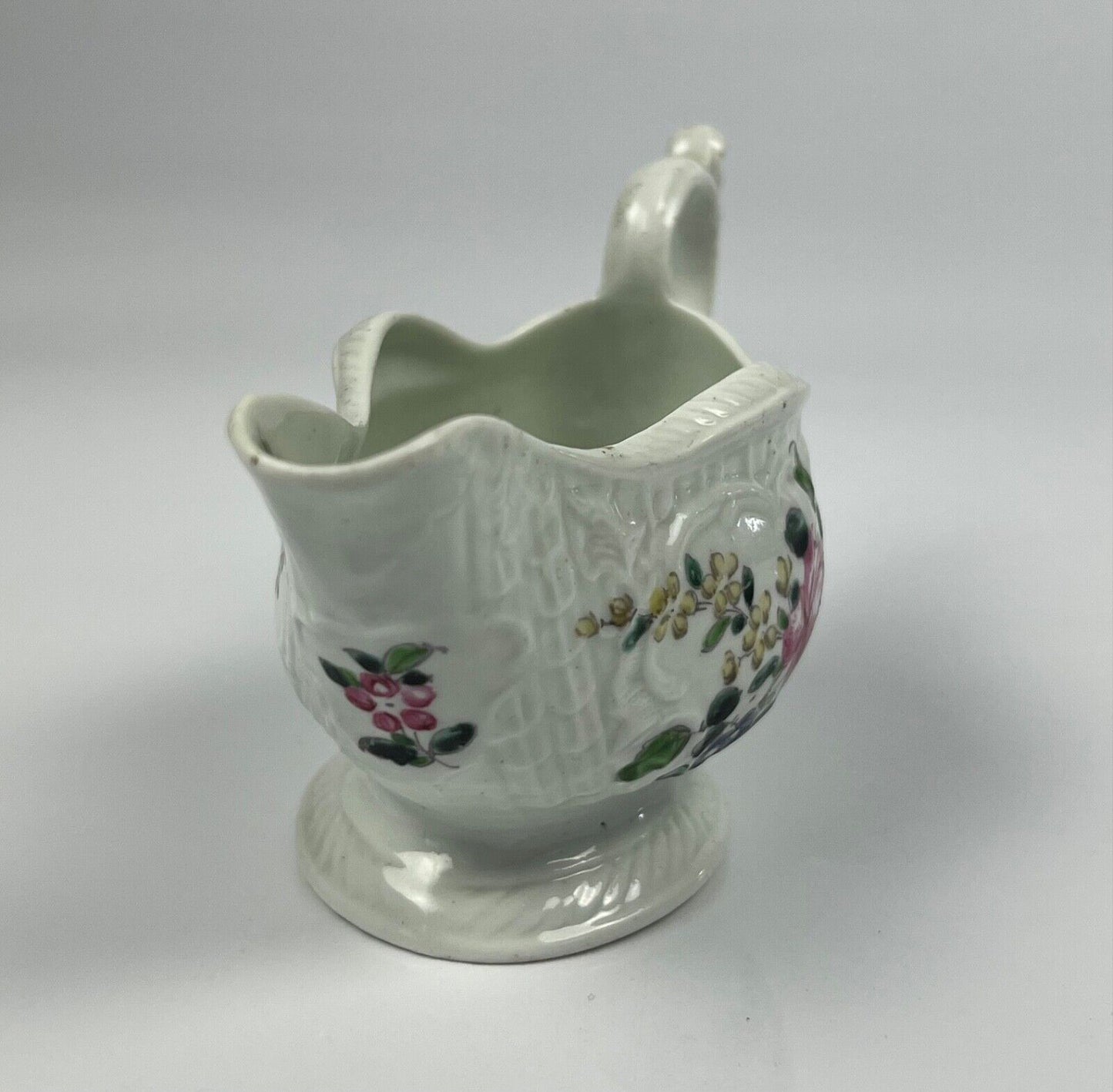 A Philip Christian Liverpool moulded polychrome porcelain sauceboat c.1770