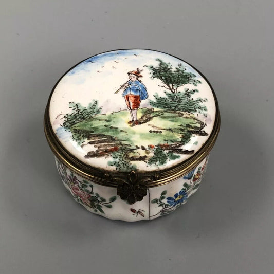 An early 19thc. Continental enamel box. Hand Painted with a boy piper.