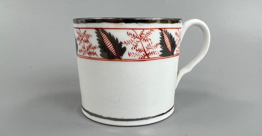 An early 19thc Coalport coffee can with silver lustre decoration.