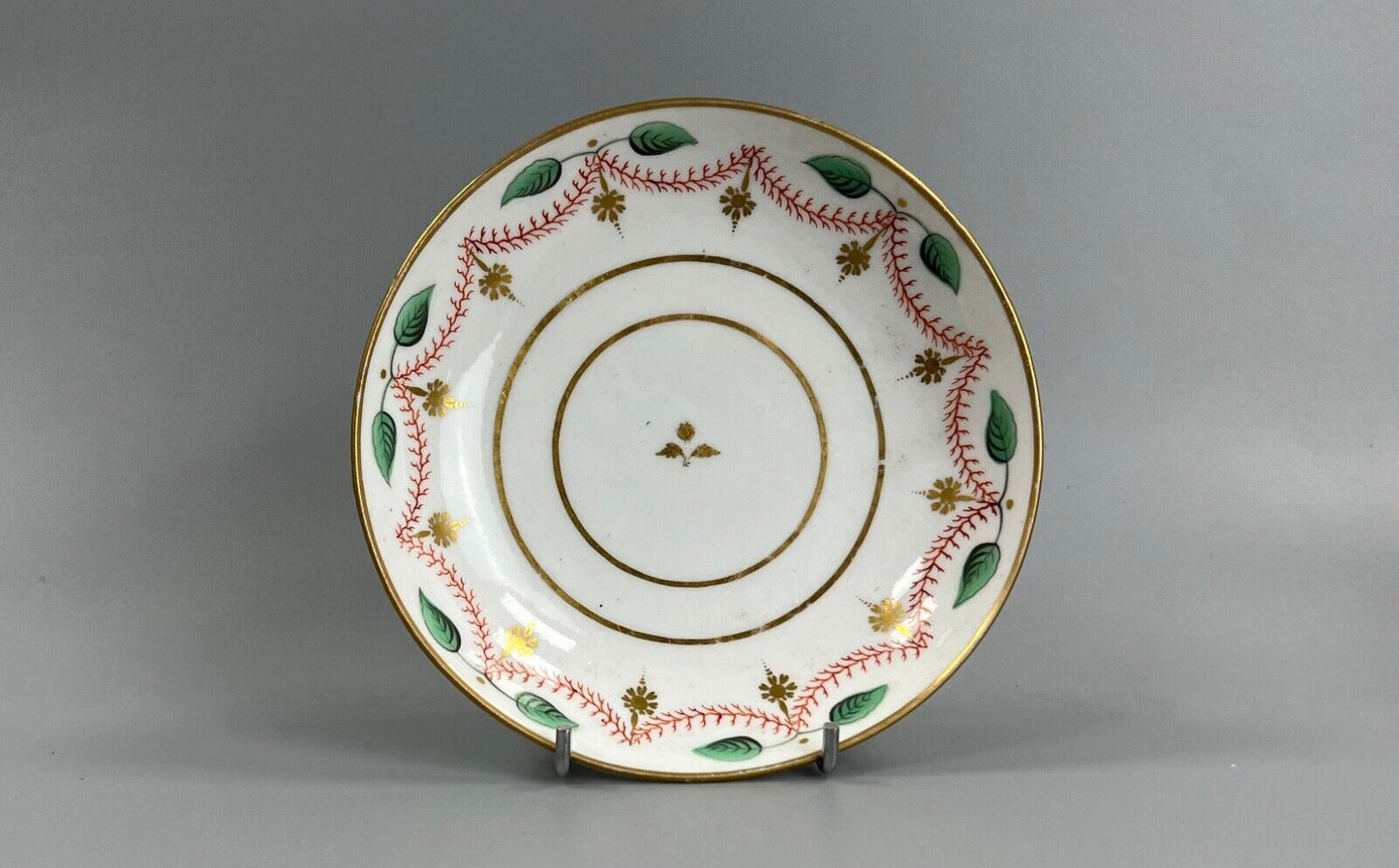An early 19thc bute shape New Hall cup and saucer in pattern number 1152
