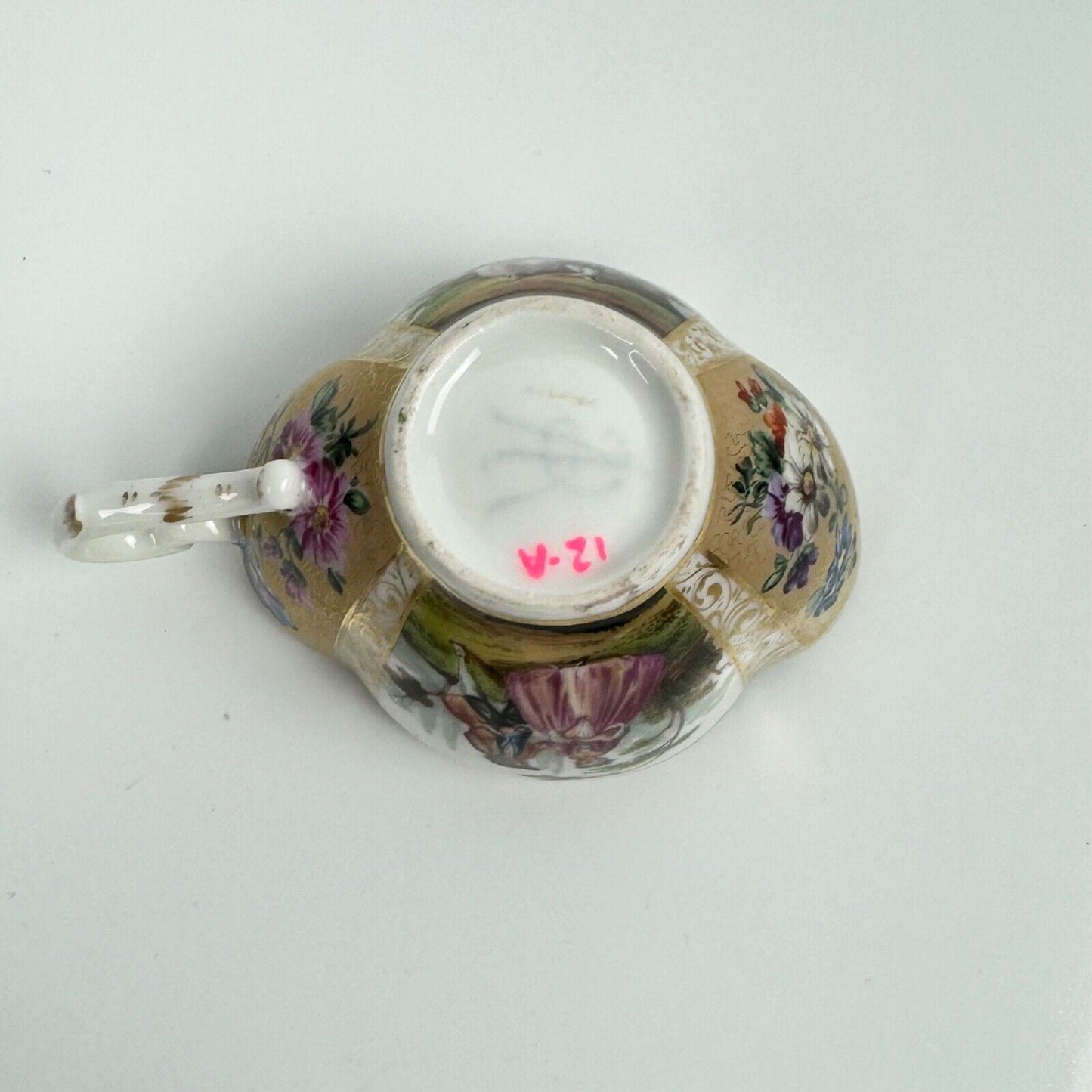 Dresden quatrefoil teacup & saucer painted with romantic scenes. 'AR' mark c1880