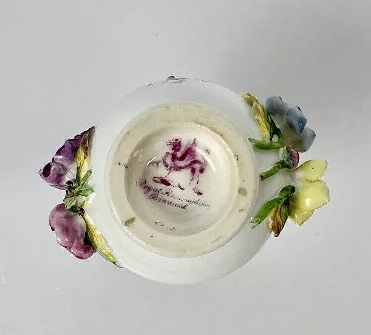 Rockingham porcelain flower encrusted tapered scent bottle. Puce Mark. c.1831-7