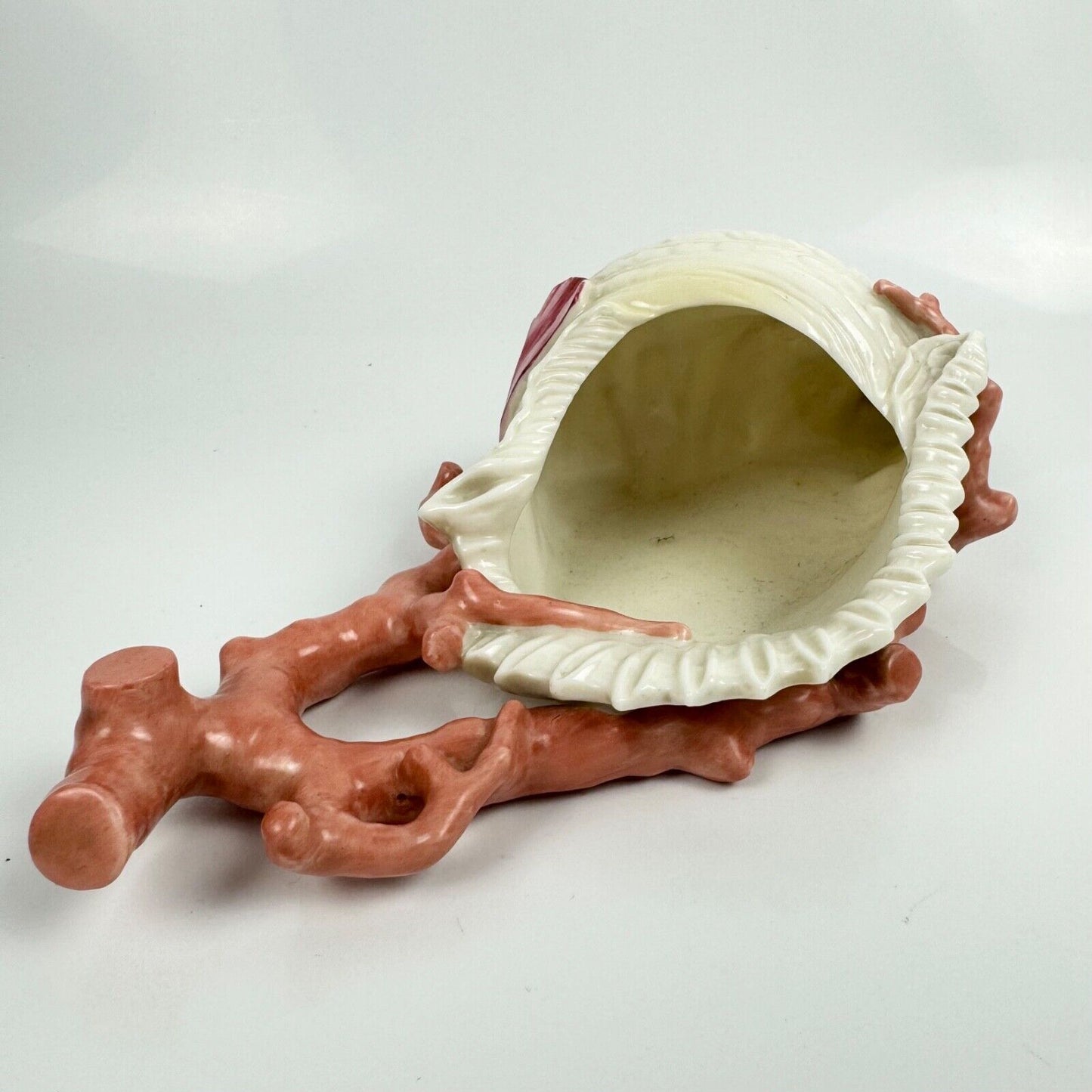 A 19thc Royal Worcester coral and shell wall pocket.
