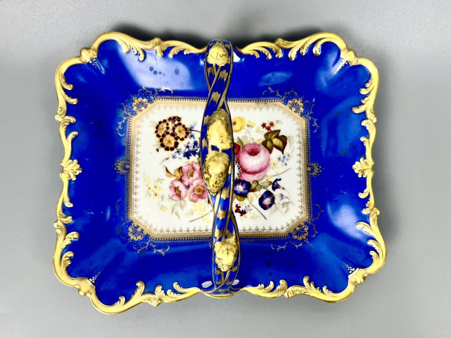 A lovely Samuel Alcock fruit basket finely painted with garden flowers. c.1830