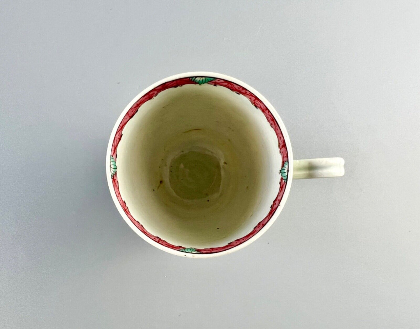 A Worcester polychrome pattern coffee cup with unusual rim decoration c.1770