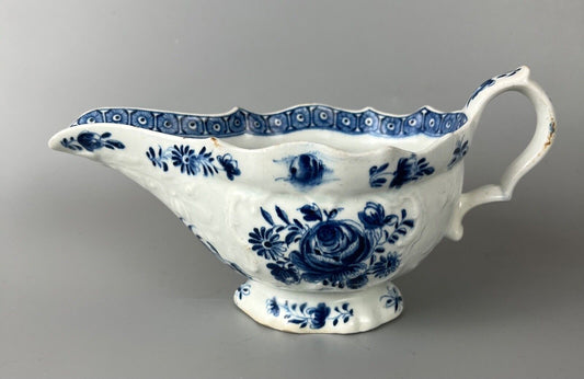 A mid 18thc Bow moulded sauceboat painted in underglaze blue c1765-70