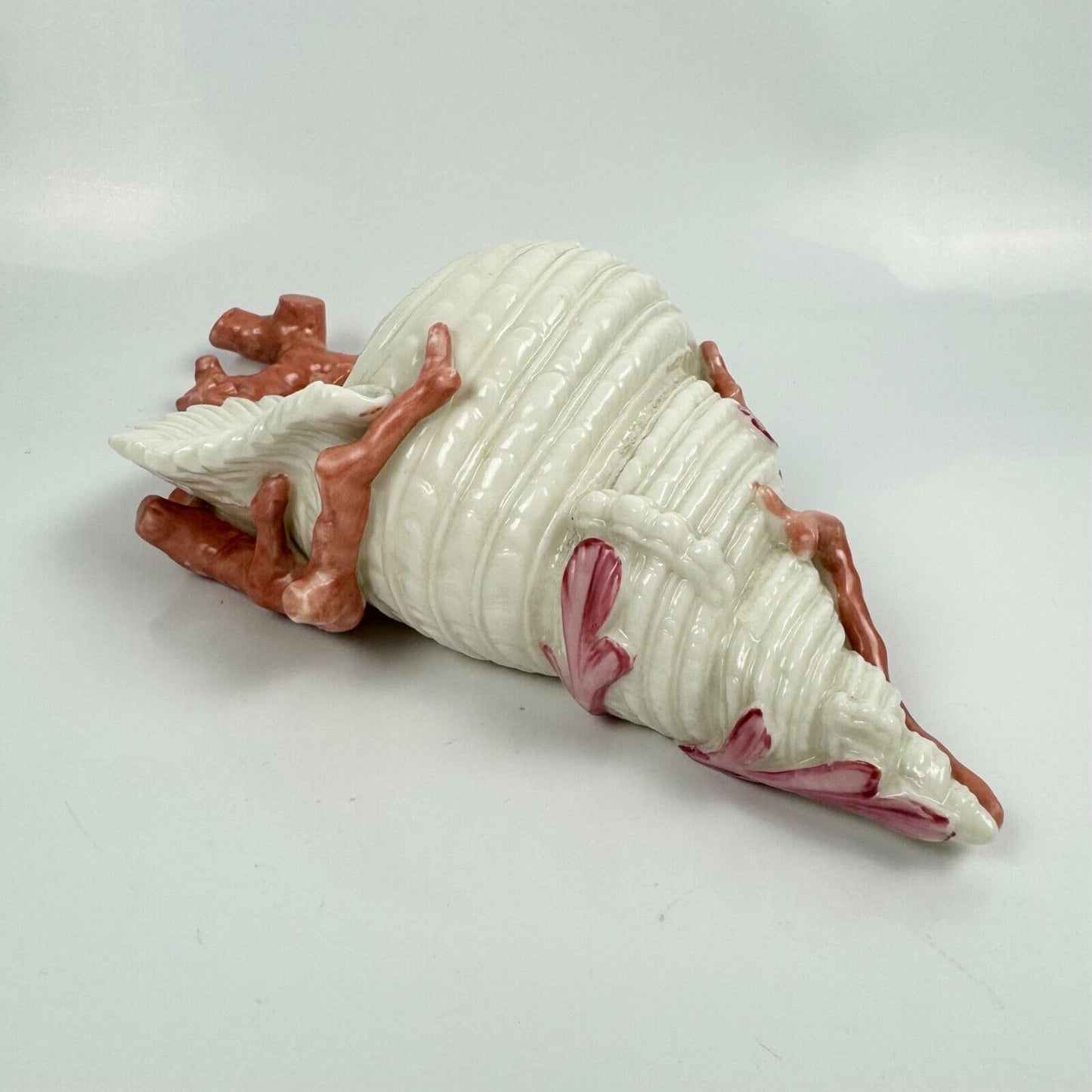 A 19thc Royal Worcester coral and shell wall pocket.