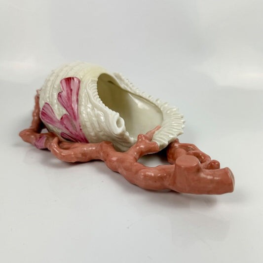 A 19thc Royal Worcester coral and shell wall pocket.
