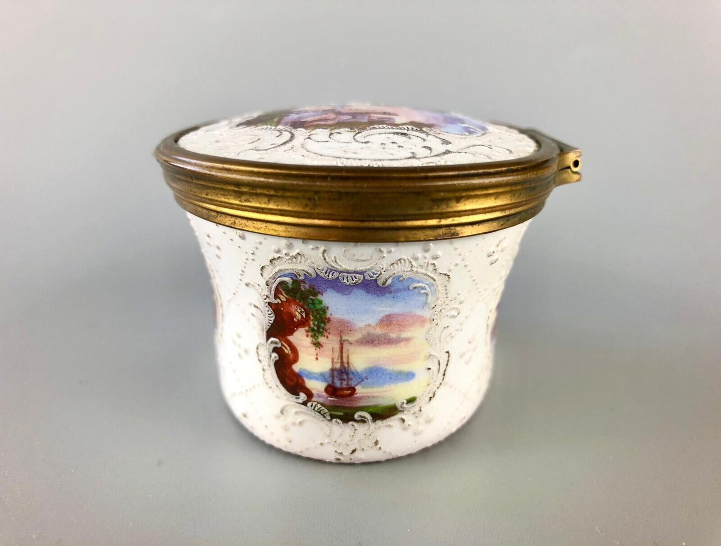 A superb 1775 enamel on copper table snuff box painted with harbour scenes.
