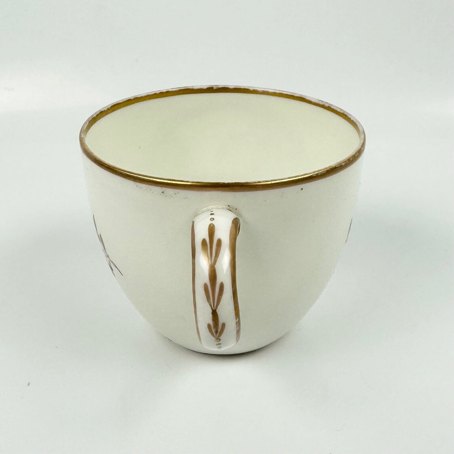 A Pinxton cup and saucer in pattern 174 with painted scenes by Billingsley c1810