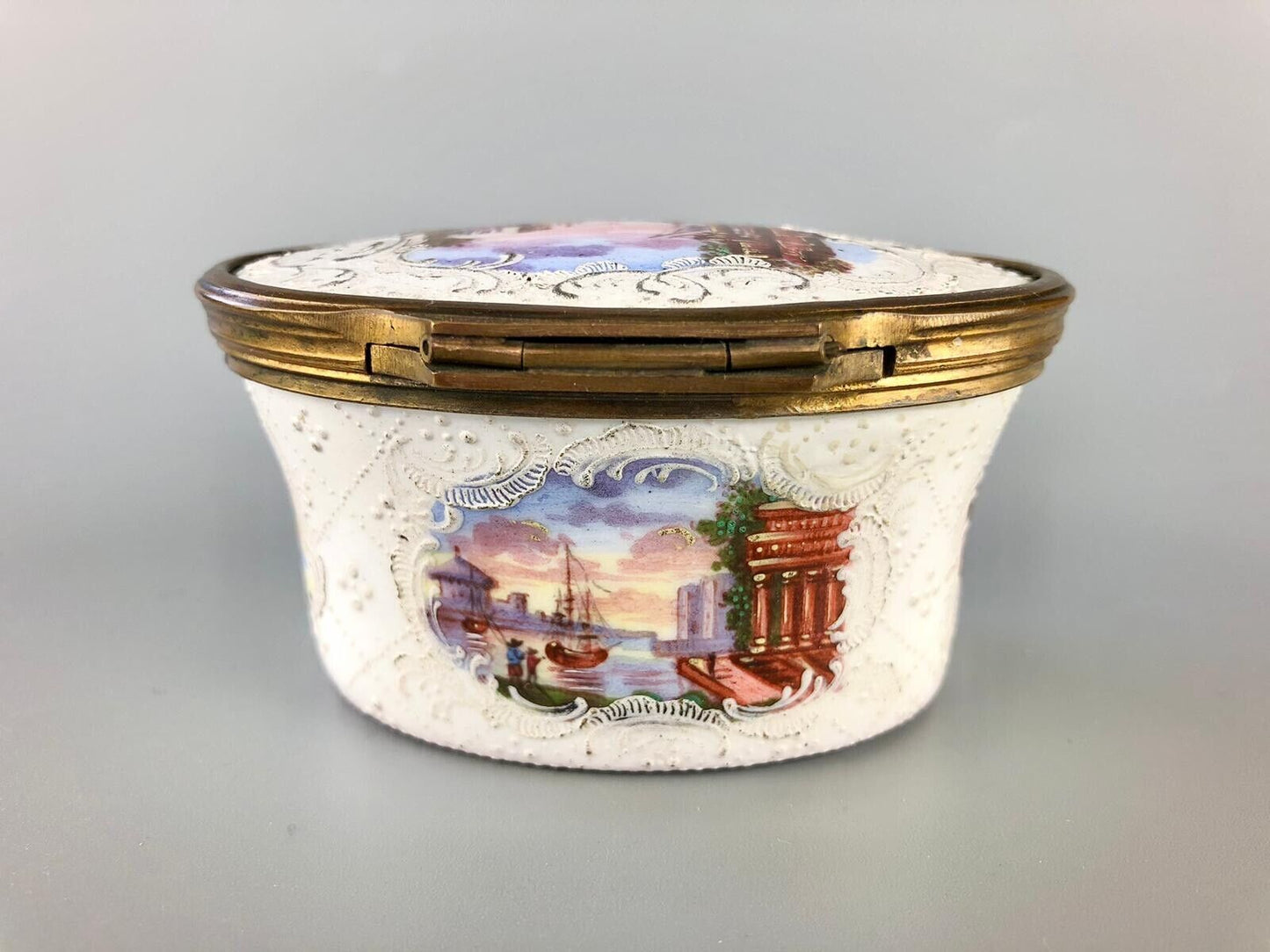 A superb 1775 enamel on copper table snuff box painted with harbour scenes.