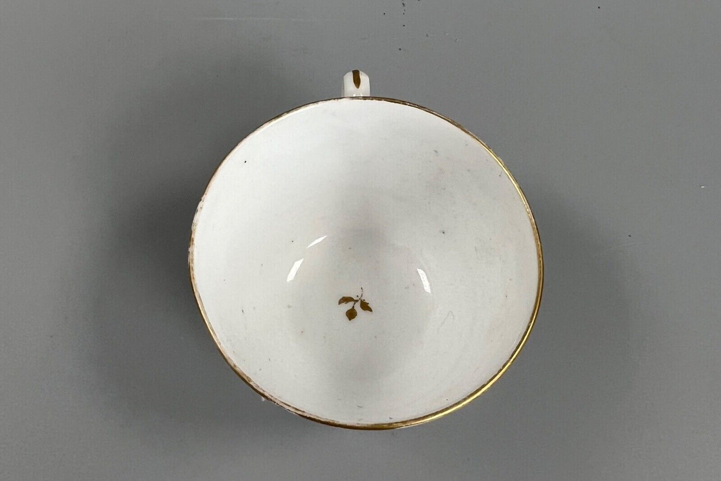 An early 19thc bute shape New Hall cup and saucer in pattern number 1152