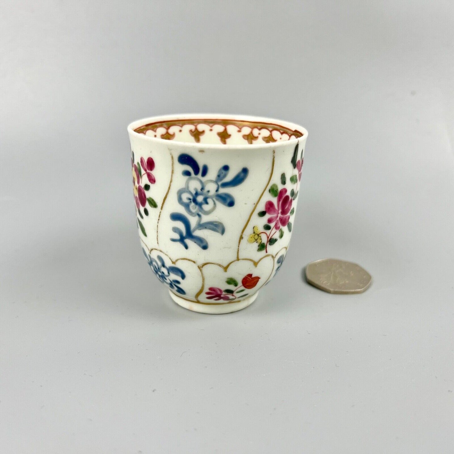 1st Period Worcester outside decorated coffee cup. Gilt trellis inner rim. c1770