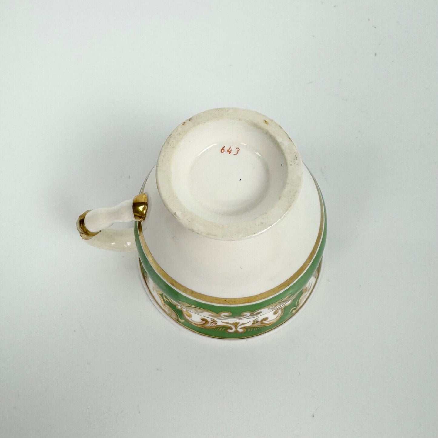 Rockingham horsetail & hoof handled coffee cup& saucer. Red griffin mark. c1826.