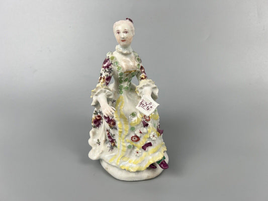A Derby 'Pale Family' figure of 'Lady Seated Holding a Musical Score'. c1756-9
