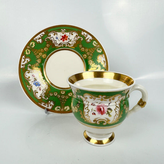 Rockingham horsetail & hoof handled coffee cup& saucer. Red griffin mark. c1826.